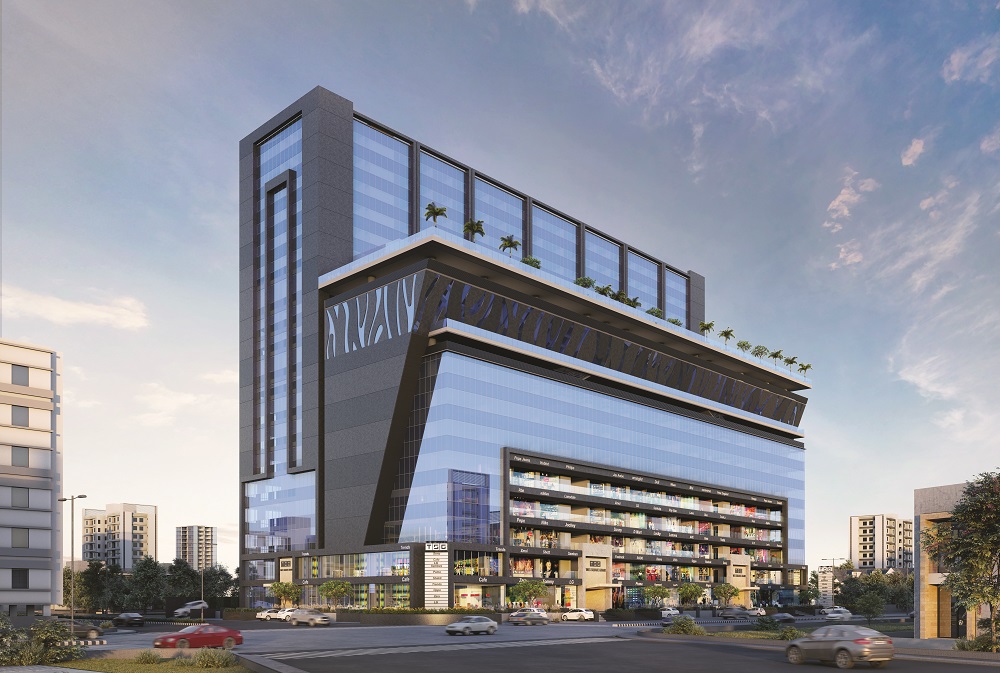 Photo of a commercial building exterior nearing completion, showing glass facade installation